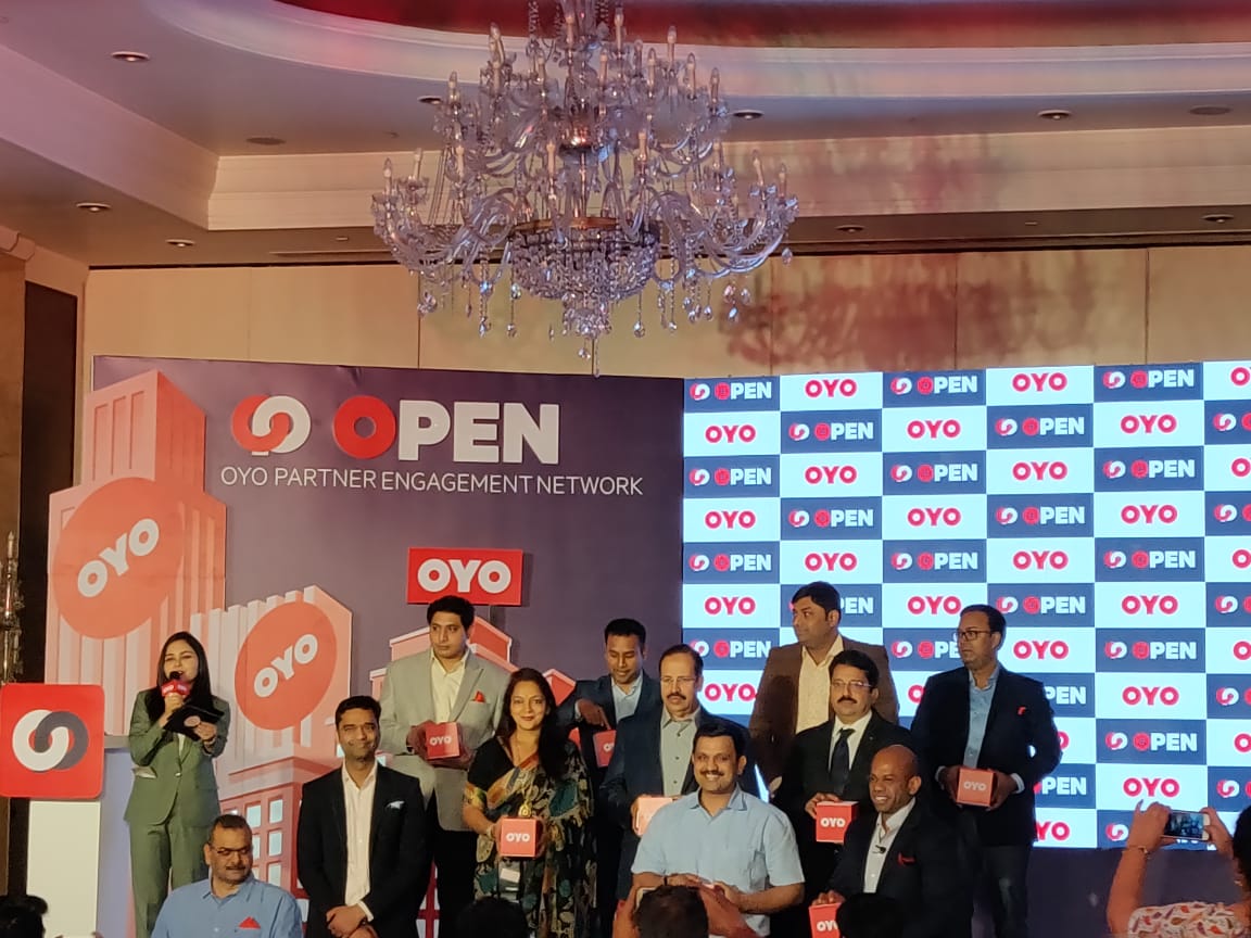 Ex.09 — OYO OPEN launch, leadership team on stage, alternate angle