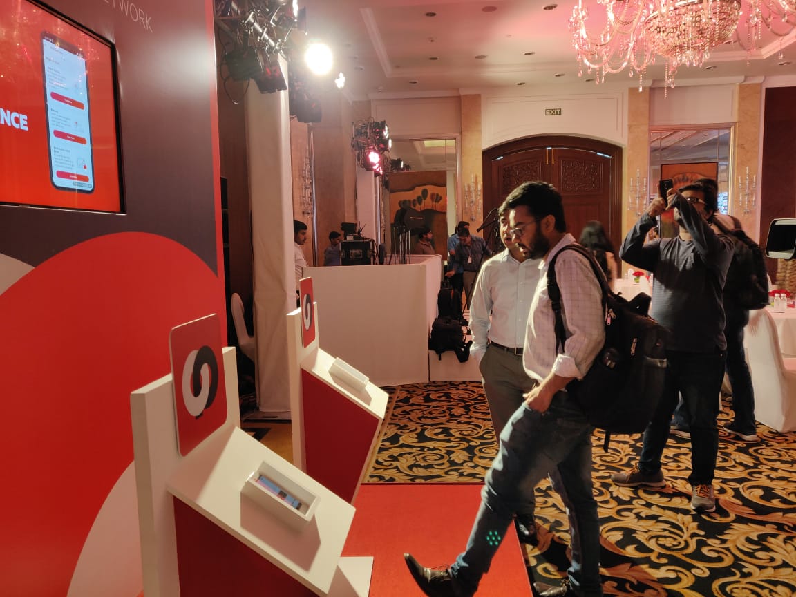 Ex.10 — press and delegates at the OYO OPEN product demo booth