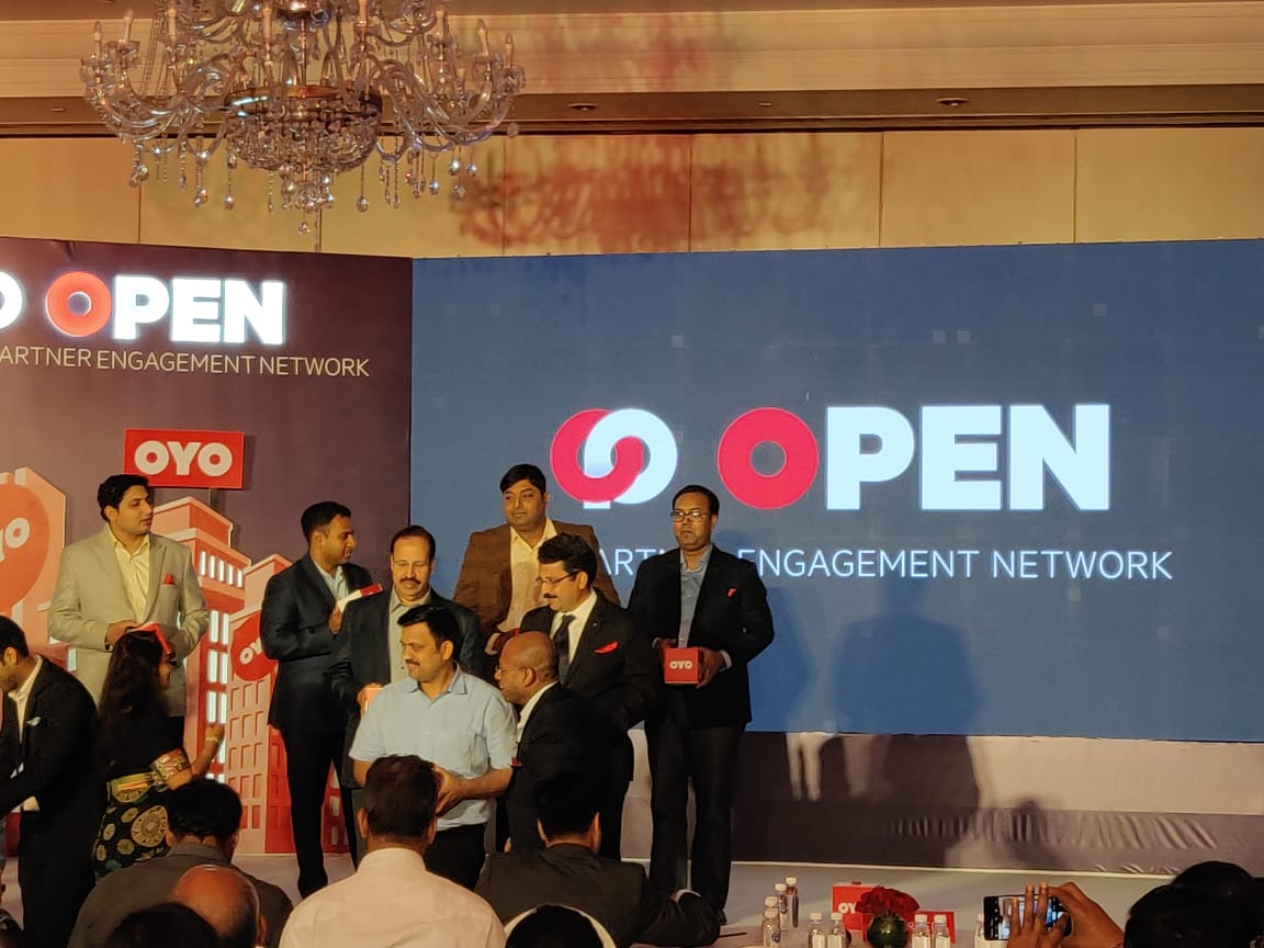 Ex.12 — OYO OPEN launch, leadership and partners group photo